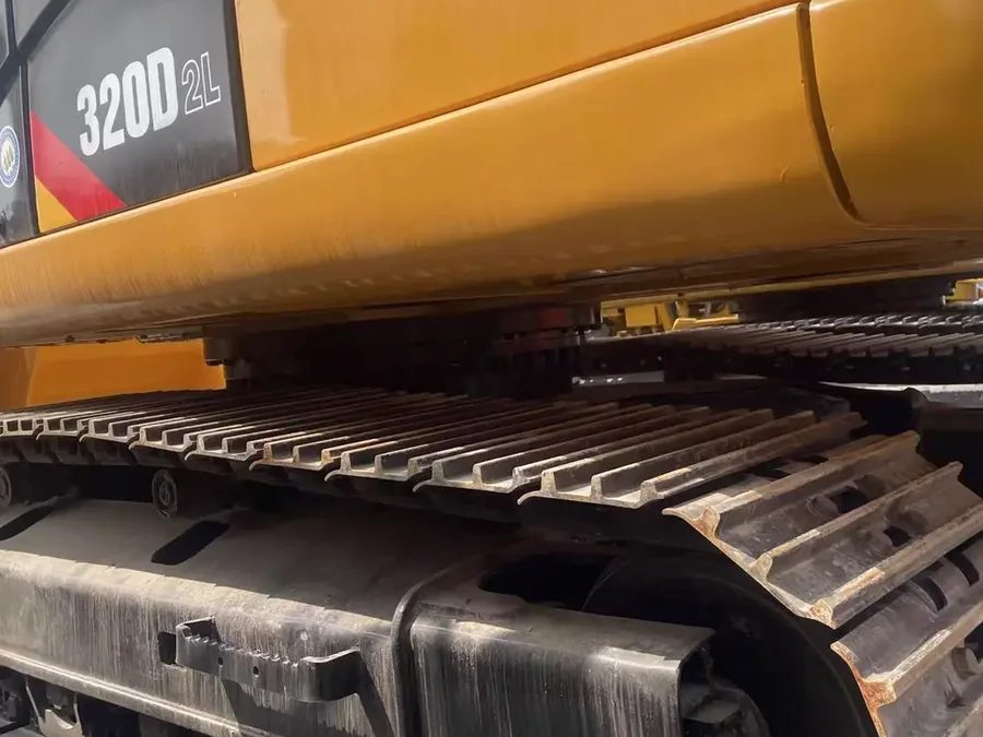Used excavator track chain and shoe plates close-up