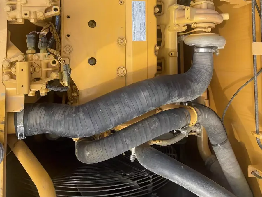 Used excavator engine hoses and lines detail